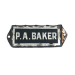 P.A. Baker, Silver Foil and Reverse Painted Glass Nameplate with Scalloped Edge