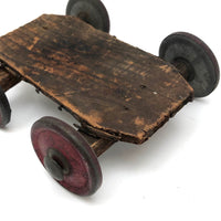 Very Sweet Little Homade Toy Cart with Red Wheels and Many Nails