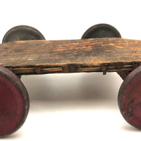 Very Sweet Little Homade Toy Cart with Red Wheels and Many Nails