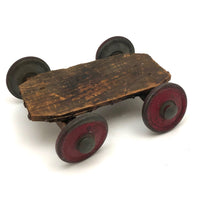 Very Sweet Little Homade Toy Cart with Red Wheels and Many Nails