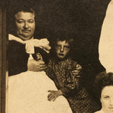 Curious Antique Photograph with Man in Wheelchair, Man on Crutches and Sickly Child