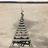 Clinging to the Top, Old Snapshot Photo of Tower Climber