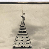 Clinging to the Top, Old Snapshot Photo of Tower Climber