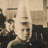 Boy in Dunce Cap in Classroom, Poignant Old Snapshot Photo