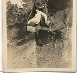 Many Times Awkward, Vintage Snapshot of Young Person Posing on Uprooted Trunk