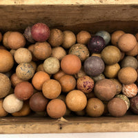 Old Wooden Box Filled with Antique Clay Marbles