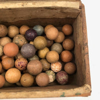 Old Wooden Box Filled with Antique Clay Marbles