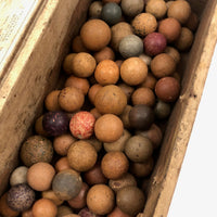 Old Wooden Box Filled with Antique Clay Marbles