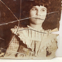 Striking Torn Up and Taped Back Together Old Photo of Girl Looking Sideward