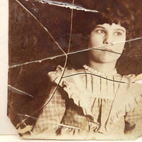 Striking Torn Up and Taped Back Together Old Photo of Girl Looking Sideward