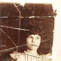 Striking Torn Up and Taped Back Together Old Photo of Girl Looking Sideward