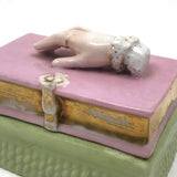 Book Shaped Porcelain Inkwell with Resting (But Poised to Write) Hand