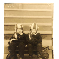 Twins in Striped Hats and Scarves and Wooly Snowsuits, in Wagon, Old RPPC