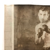 Photo of Photo of Young Boxer Against Lined Paper