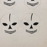 Excellent Untouched Set of Four c. 1930s Die Cut Skulls