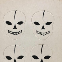 Excellent Untouched Set of Four c. 1930s Die Cut Skulls