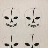 Excellent Untouched Set of Four c. 1930s Die Cut Skulls