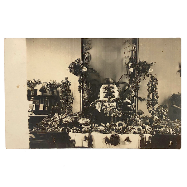 Intense Woman with Elaborate Harvest Display, Antique Real Photo Postcard