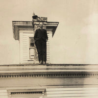 Man at Edge of Roof, Old Snapshot with Black Paper Backing