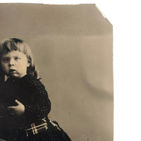 Holding On: Unusual Composition, Unusual Looking Child, Striking Antique Sixth Plate Tintype