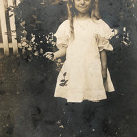 Girl with Rose, Huge Bow and Excellent Smile, 1909 RPPC (with Flag Cancellation)