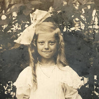 Girl with Rose, Huge Bow and Excellent Smile, 1909 RPPC (with Flag Cancellation)