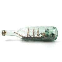 Wonderful Old Folk Art Ship in a Bottle with Little Houses, Flags, and Tower Perched on Push Up Bottom