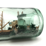 Wonderful Old Folk Art Ship in a Bottle with Little Houses, Flags, and Tower Perched on Push Up Bottom