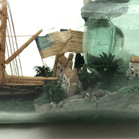 Wonderful Old Folk Art Ship in a Bottle with Little Houses, Flags, and Tower Perched on Push Up Bottom