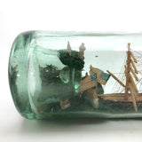 Wonderful Old Folk Art Ship in a Bottle with Little Houses, Flags, and Tower Perched on Push Up Bottom