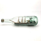 Wonderful Old Folk Art Ship in a Bottle with Little Houses, Flags, and Tower Perched on Push Up Bottom