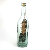 Wonderful Old Folk Art Ship in a Bottle with Little Houses, Flags, and Tower Perched on Push Up Bottom