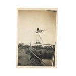 Woman on High Pointing Rifle, Old Snapshot Photo