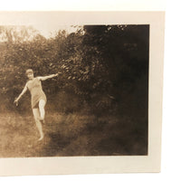 Suspended Gesture, In Between, Old Snapshot Photo of Woman in Swim Costume