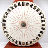 Spinning Orange and White Carnival Wheel of Chance, A-Z Plus 1-6